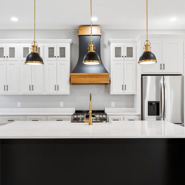 Black custom wood range hood with natural wood accents