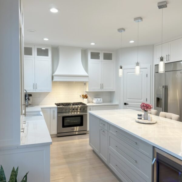 Custom wood range hood vent cover installed in kitchen