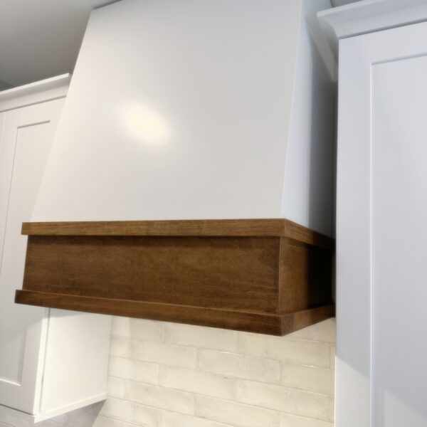 Custom wood range hood with white and stained finish